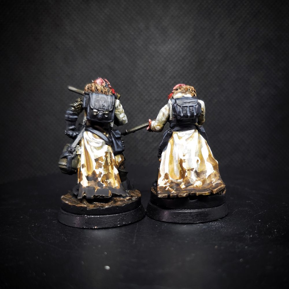 The soldiers from behind, showing their backpacks