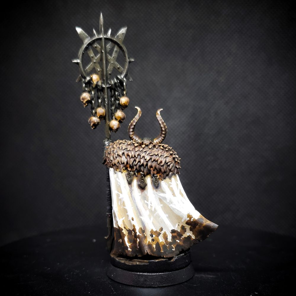 Another angle, from behind, showcasing the dirty white cloak