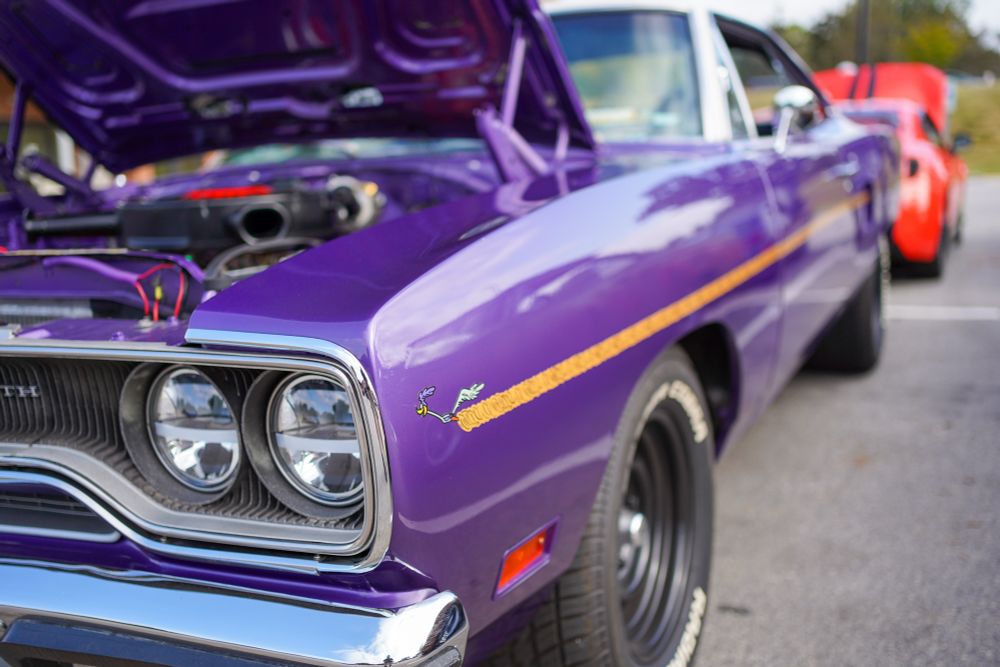 Color photograph of gloriously purple Plymouth Road Runner from last weekend’s car show. 