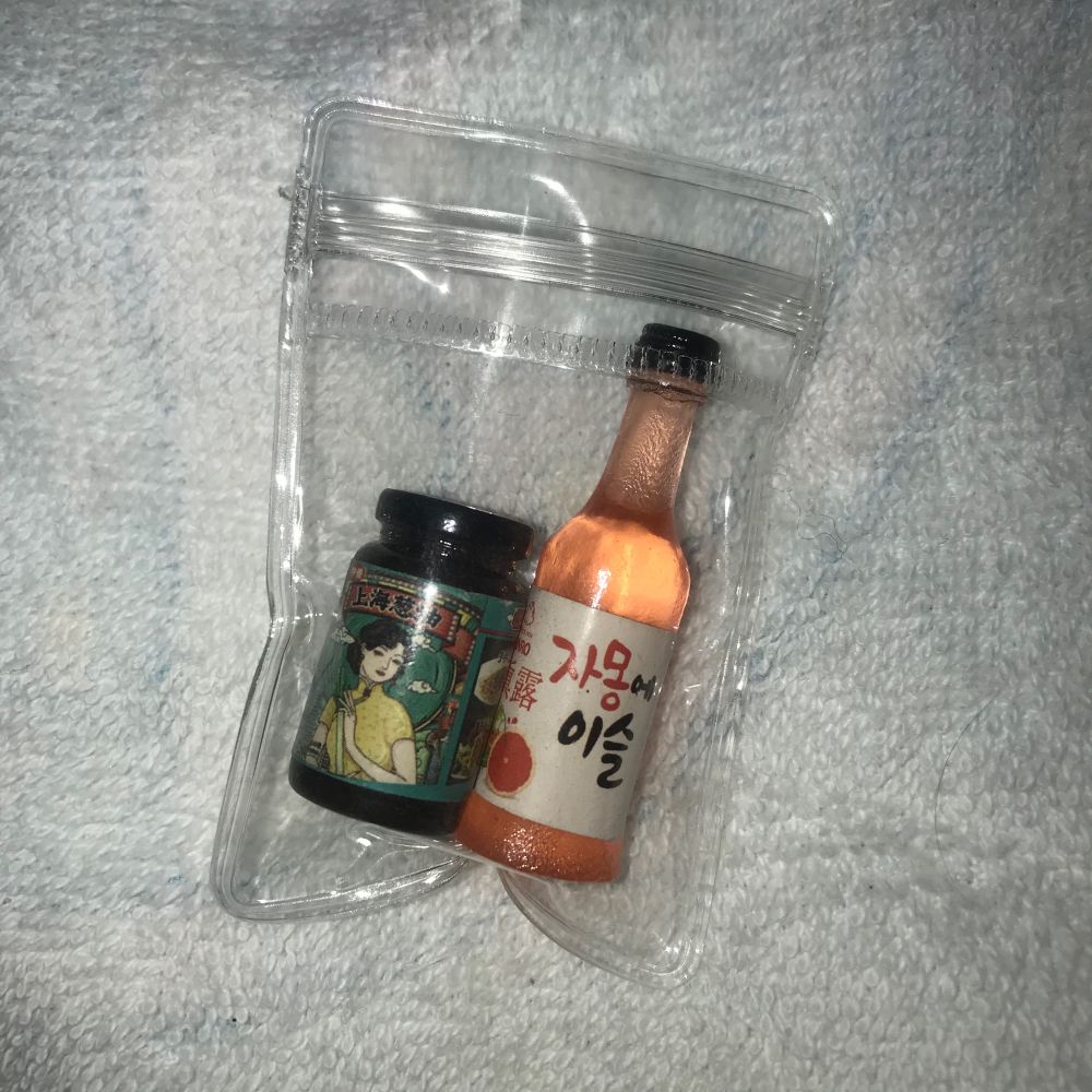 Miniatures of scallion sauce jar and grapefruit soju