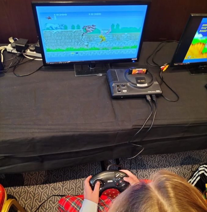 A young person, playing Altered Beast on a retro console. Picture by author