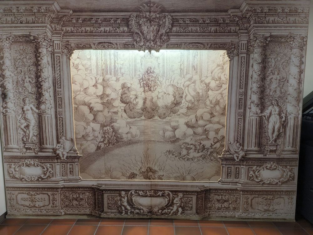 A cardboard reconstruction of a drawing of an ephemeral festival arch and intermedi scene.