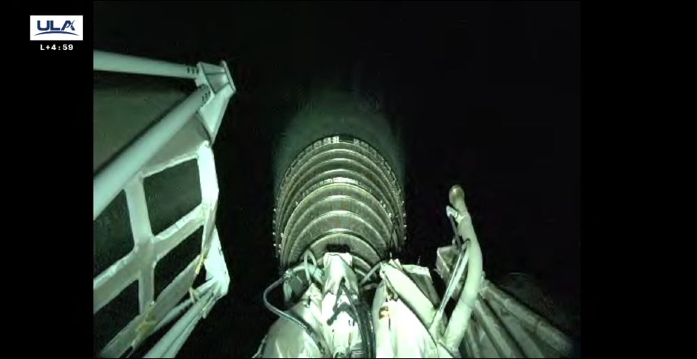 Greenish shot of rocket engine in space.