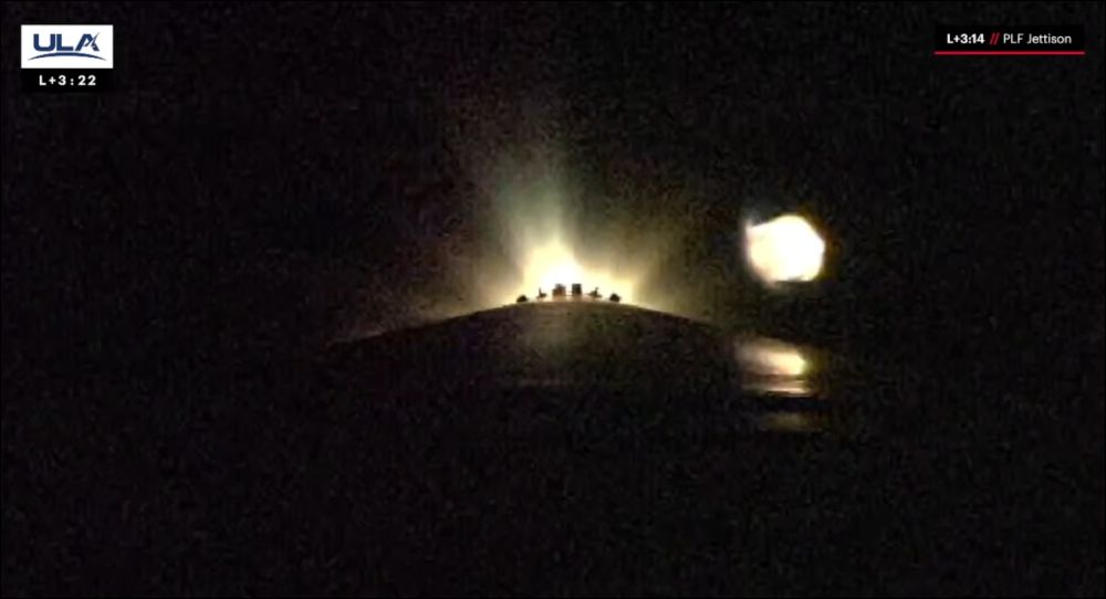 Bright flash of exhaust reflecting off part of the fairing as it is jettisoned.