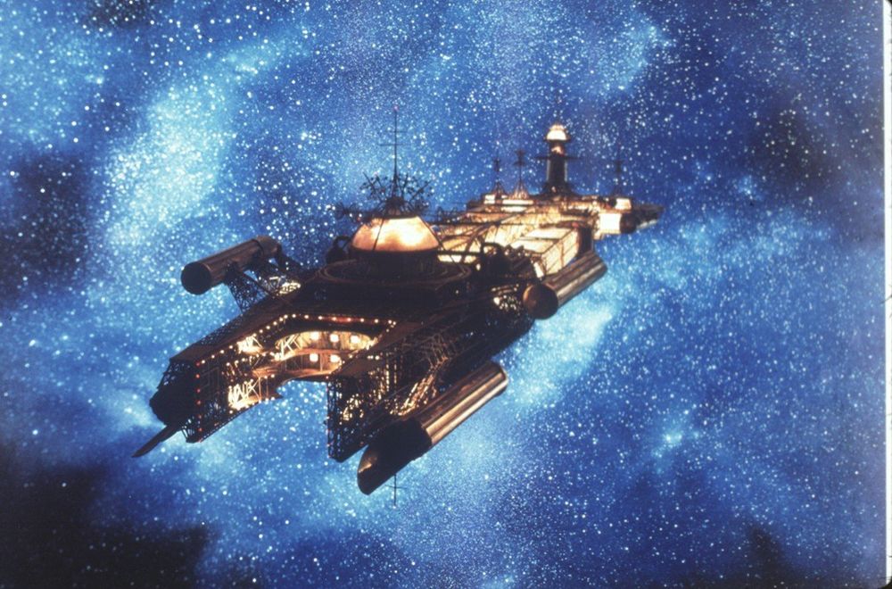 still from the Black Hole of a lone ship floating in the depths of space 