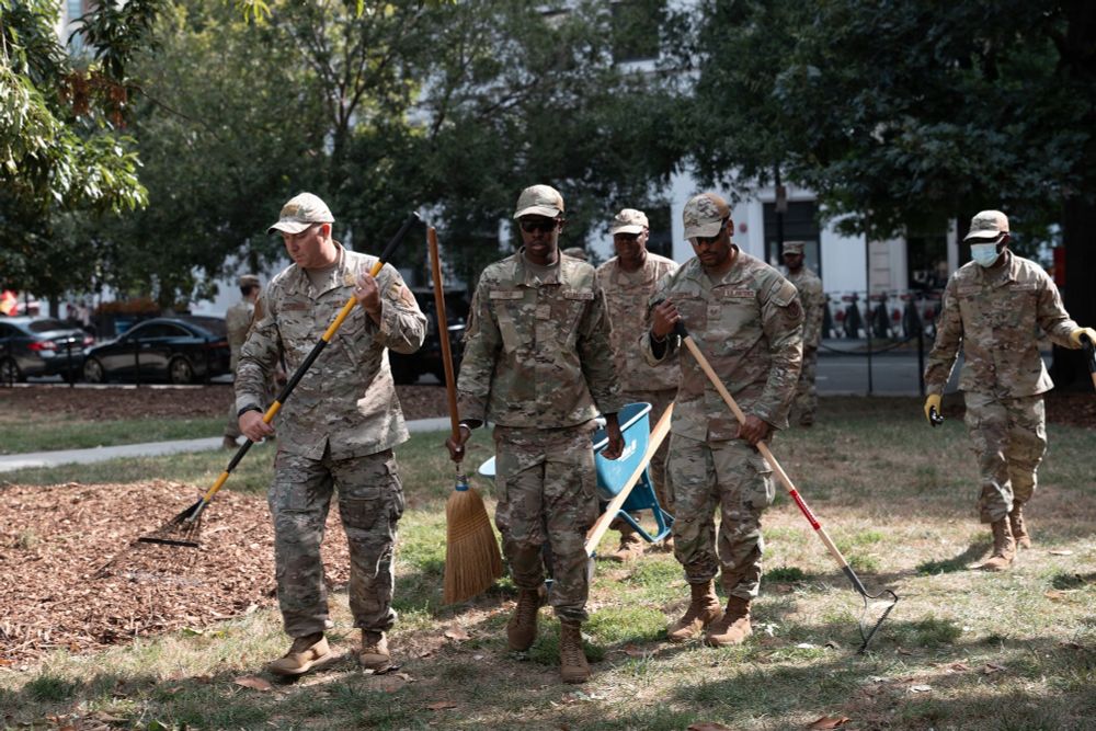 Deployed National Guard troops picking up trash in Washington DC.