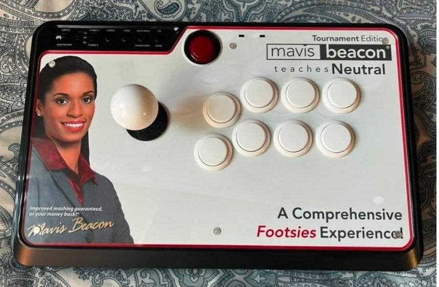 A fighting stick that has a picture of Mavis beacon on it, Mavis beacon teaches neutral tournament Edition