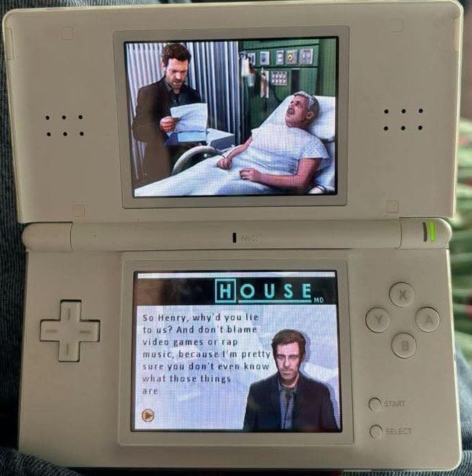 The picture depicts a white Nintendo DS and the DS version of House MD 

The image on the screen shows house accusing a patient by saying 
"So Henry why do you lie to us? And don't blame video games or rap music because I'm pretty sure you don't even know what those things are"