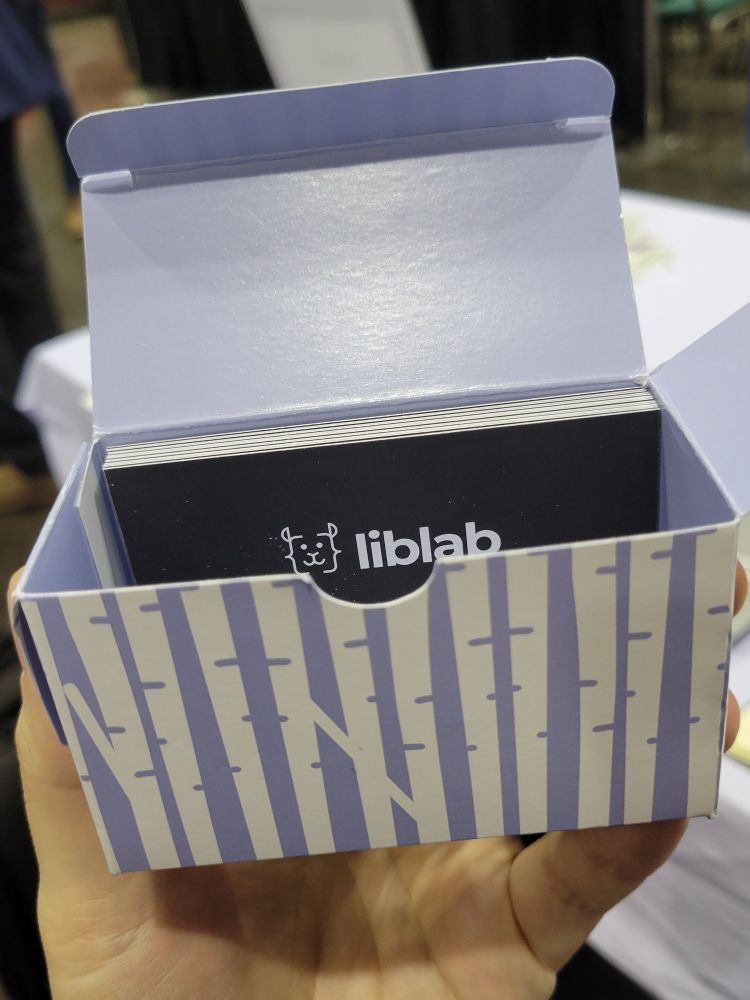 A nearly empty box of business cards