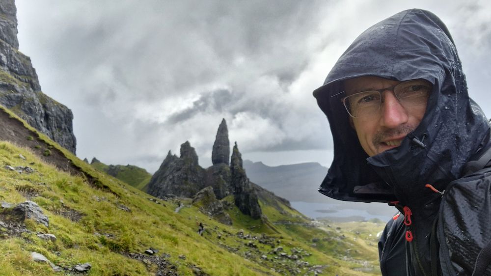 The Old Man of Storr rocks on the Isle of Skye. Man in the foreground.