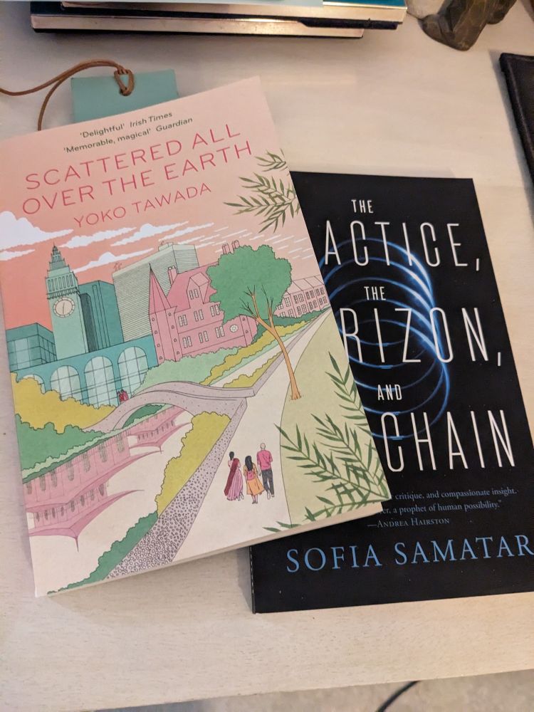Scattered All Over The Earth by Yoko Tawada and The Practice, The Horizon, And The Chain by Sofia Samatar resting on a counter 