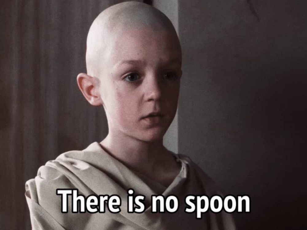 a bald child with the words there is no spoon written below him