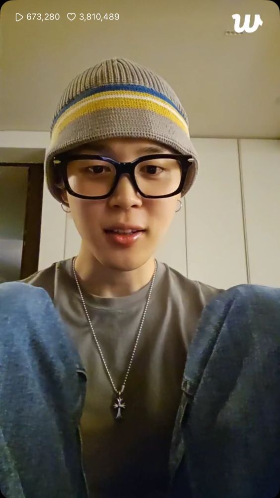 Park Jimin of BTS in a knit cap, glasses, olive tshirt and jeans