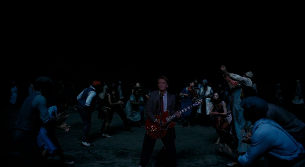 It's the big dracula jamboree from Sinners, except instead of the Irish vampire dancing a jig, it's Marty McFly playing Johnny B Goode from Back to the Future