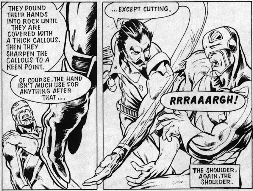 Two panels. In the first, the two are still facing each other down, but now we are seeing the baddie's hand in the foreground, while Cap holds his shoulder in the background. The baddie monologues, "They pound their hands into rock until they are covered with a thick callous. Then they sharpen the callous to a keen point. Of course, the hand isn't much use for anything after that..." In the second panel, the baddie has sliced open Cap's costume, again at the shoulder. He says, "...except cutting." Cap says "RRRAAARGH!" There is a caption that says "The shoulder, again. The shoulder."