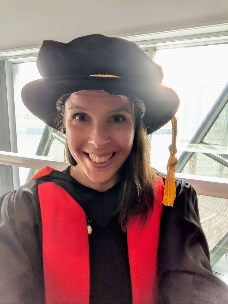 Person in PhD cap and gown