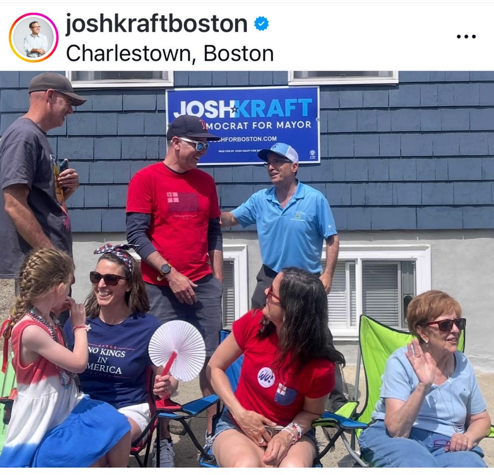 Josh Kraft Instagram post from Bunker Hill parade with Josh talking to a guy and people watching the parade. 