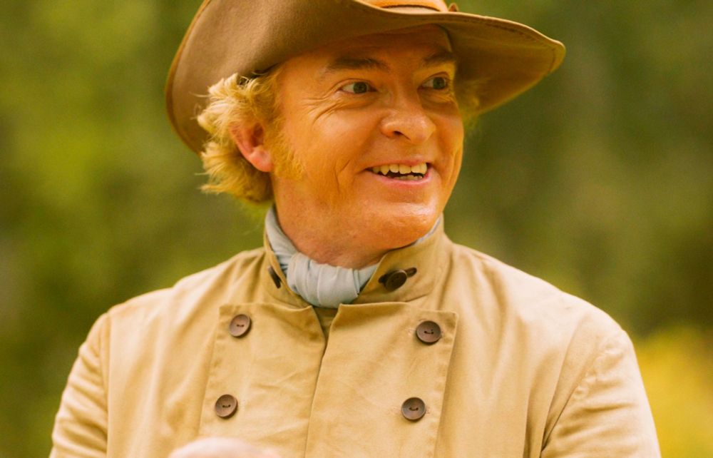 advincha fit stede bonnet looking smiley and giddy because he got the rock back from jim and didn't want to give it to them anyways (our flag means death s1e7)