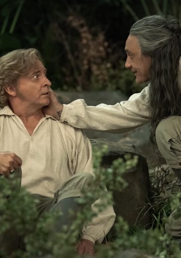 ed teach gently caressing stede's face, stede is still scared and surprised but he makes ed happy (our flag means death, technically s1e9, this is from some random video hbo max dropped because they're monsters gatekeeping extra kisses and other goodies) 