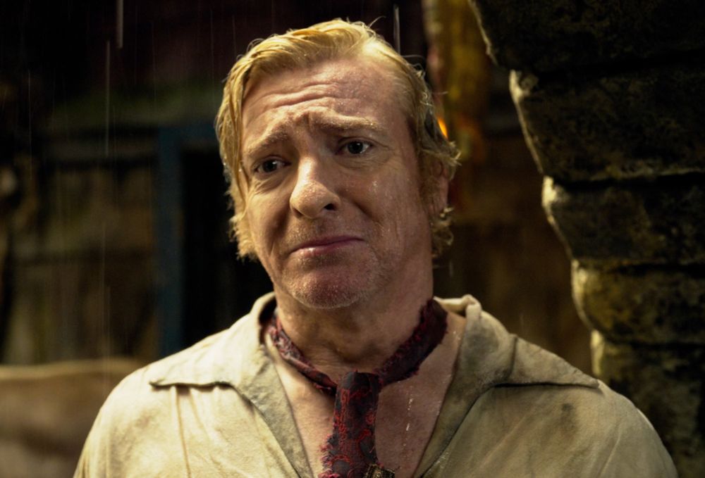 image mostly for algorithm purposes, but also relatable, stede bonnet standing in the rain, sad, drenched, trying not to cry (our flag means death s2e1)