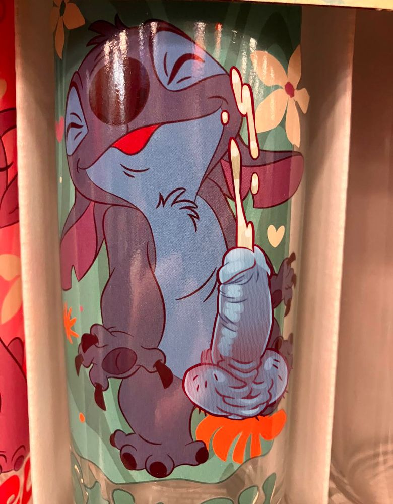 A cup with Stitch experiencing a really satisfying orgasm on it. His fat blue hairy ballsack is all scrunched up trying to push all of his sperm out of his dick, and he's really loving it.