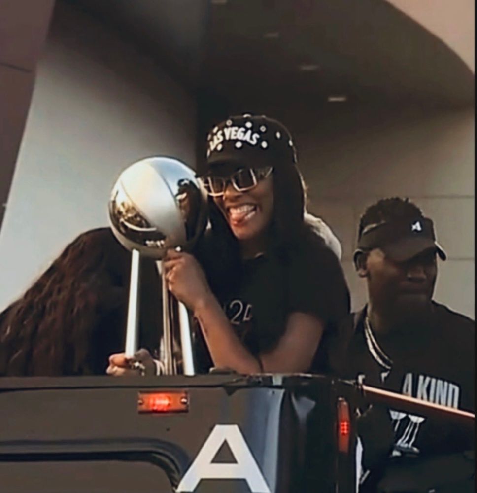 a’ja wilson with the championship trophy 