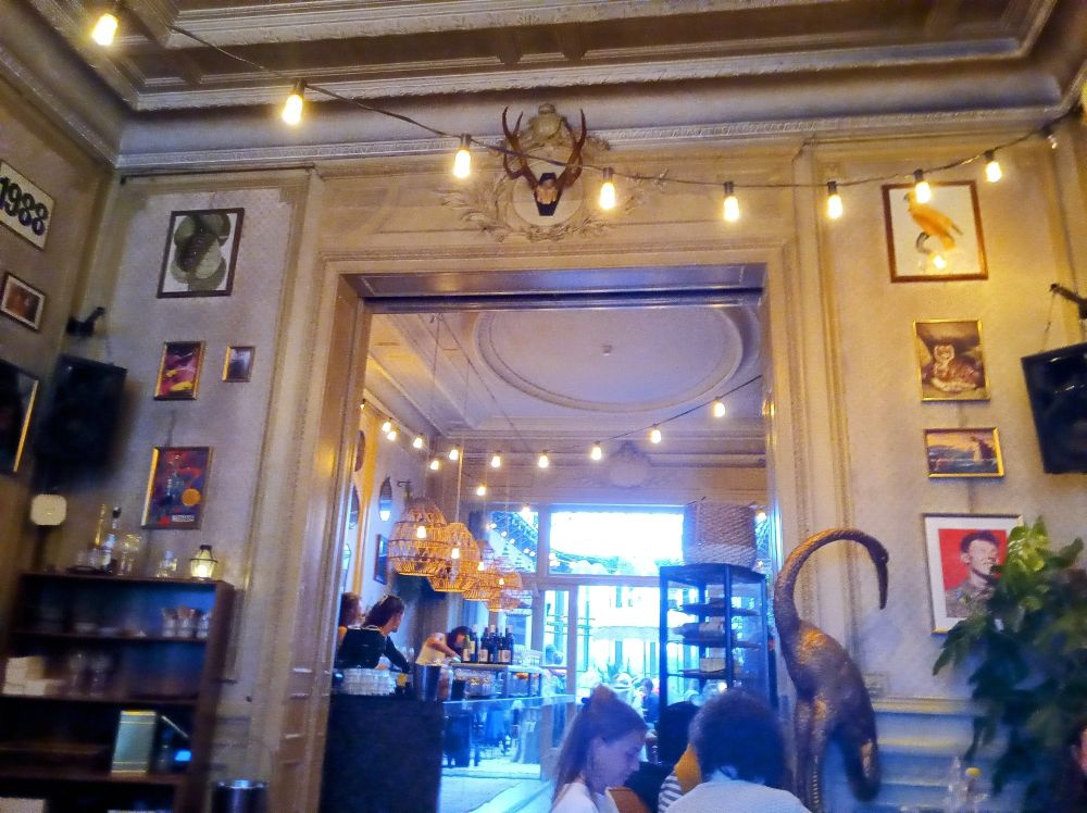 A beautiful bar with fairy lights strung across the room. 