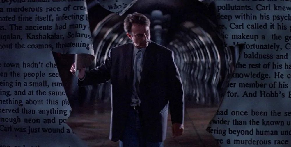 Still from In the Mouth of Madness of a man peering through an enormous hole made in a wall of pages 