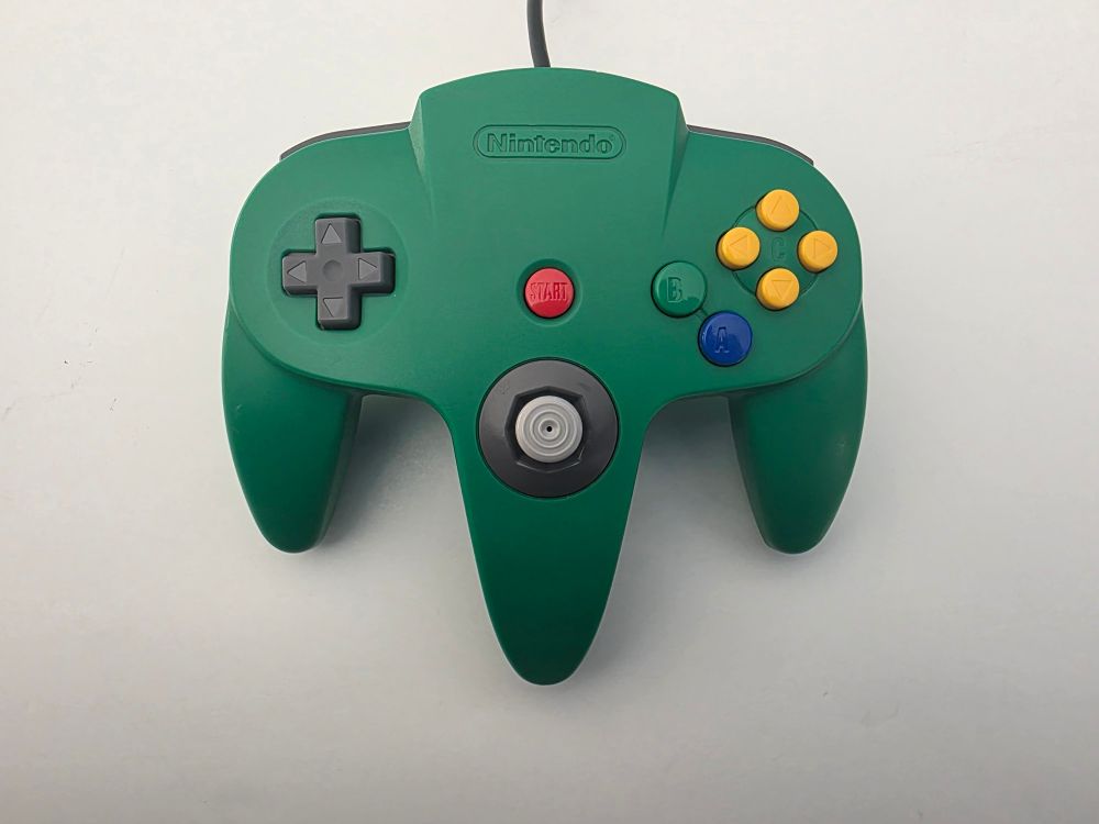 A green Nintendo 64 controller. 
