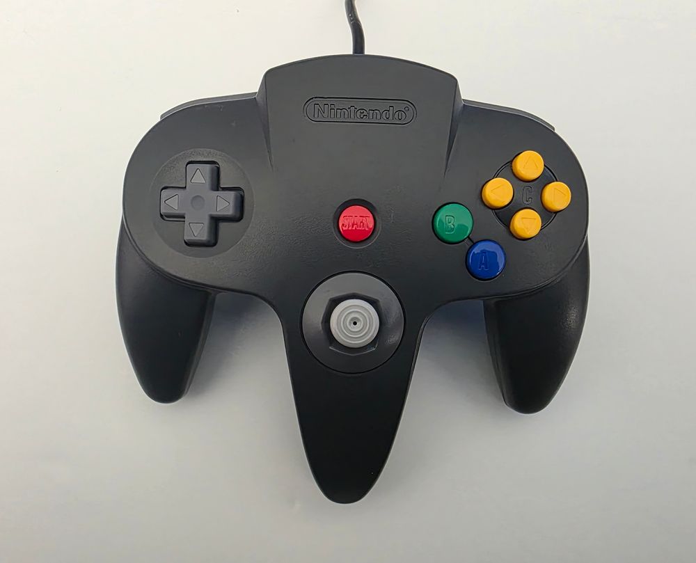 A black Nintendo 64 controller. 