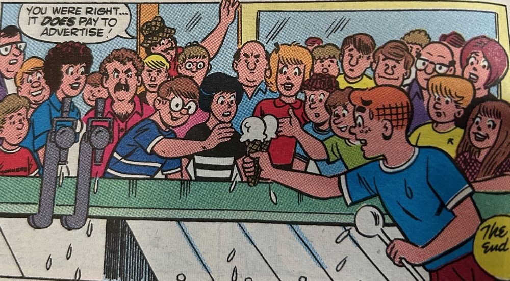 Archie Andrews, a redheaded teenager, nervously serves ice cream to a large crowd at an ice cream parlor. Pop Tate, a middle-aged man with a mustache, is at the entrance to the store, about to leave, saying, "You were right...It does pay to advertise!"