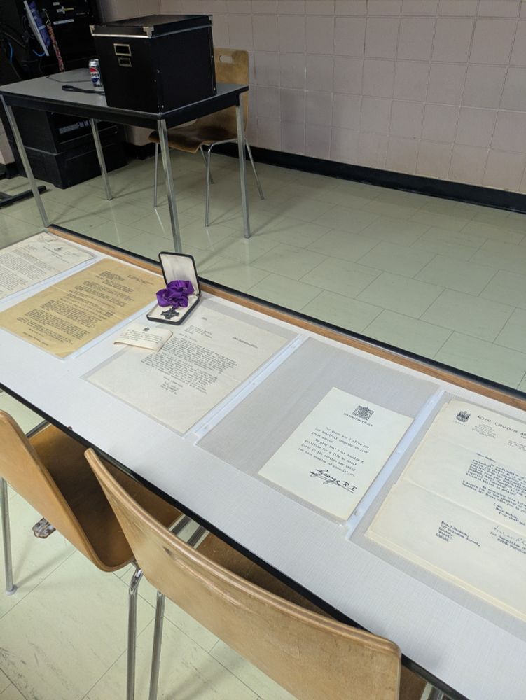 A series of letters on a desk outlining the death of Harry George Dickson