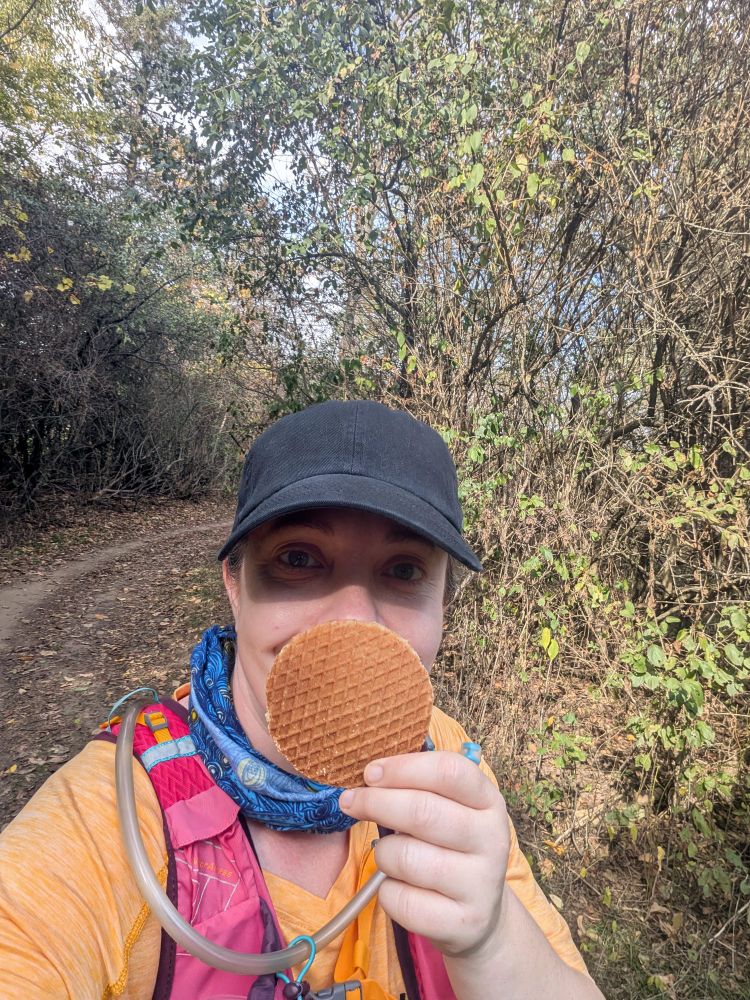 The same person holds up a stroopwafel like a host wafer in praise.