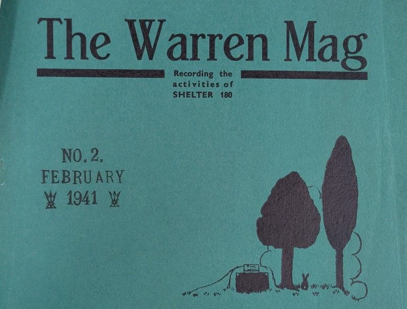 Green cover of the Warren Mag: Recording the activities of shelter 180. A doodle of a rabbit warren, small rabbit and trees is in the bottom right corner.