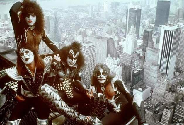 Rock band KISS photographed with NYC backdrop while atop a skyscraper