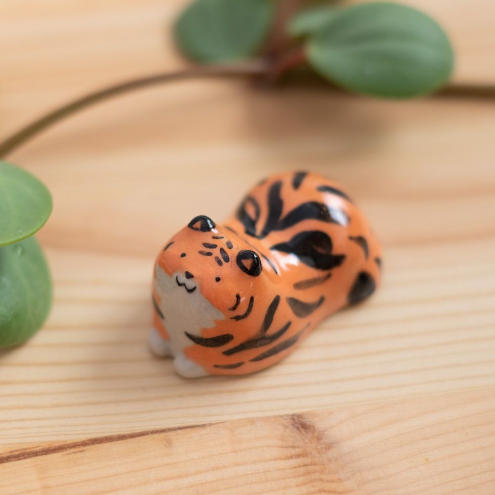 A photo of a small ceramic tiger