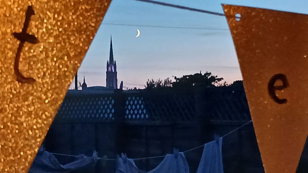 A fine new moon just to the right of the spire with the washing line of whites
and the bunting I made the other day that says Poltergeist in the foreground - back on the drawing regime tomorrow....