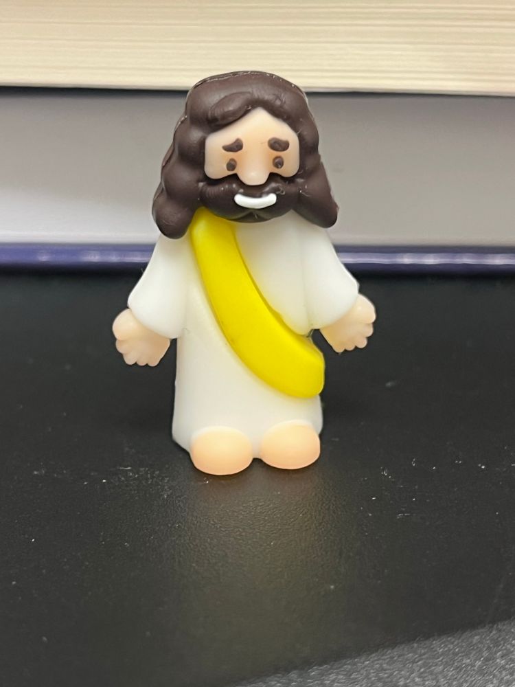 A small 3D-printed figurine of Jesus.