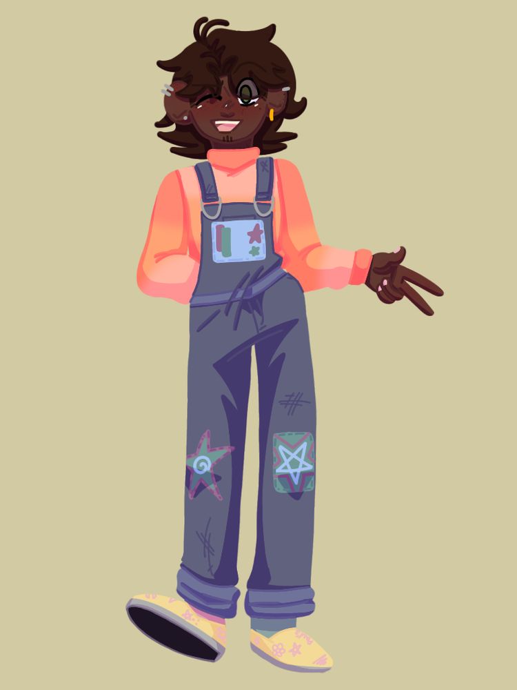 image id: Patryk from Eddsworld wearing a peach and pink jumper and blue overalls. The overalls have patches on the knees, one being a star, the other being a square. On the chest of his overalls is another square, the pocket originally there is covered but still visible. He is in light yellow shoes that are covered in pink drawings, his socks are mix match. The shoes are shaped like vans or slip-ons.