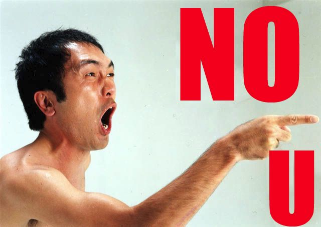 Old meme of shirtless angry looking Japanese guy shouting and pointing with the phrase in red caps "NO U"