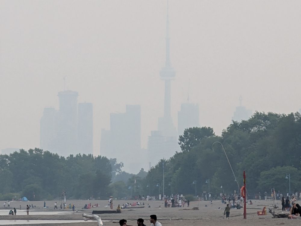 View of downtown Toronto from the beaches, about 10km away obscured by smoke