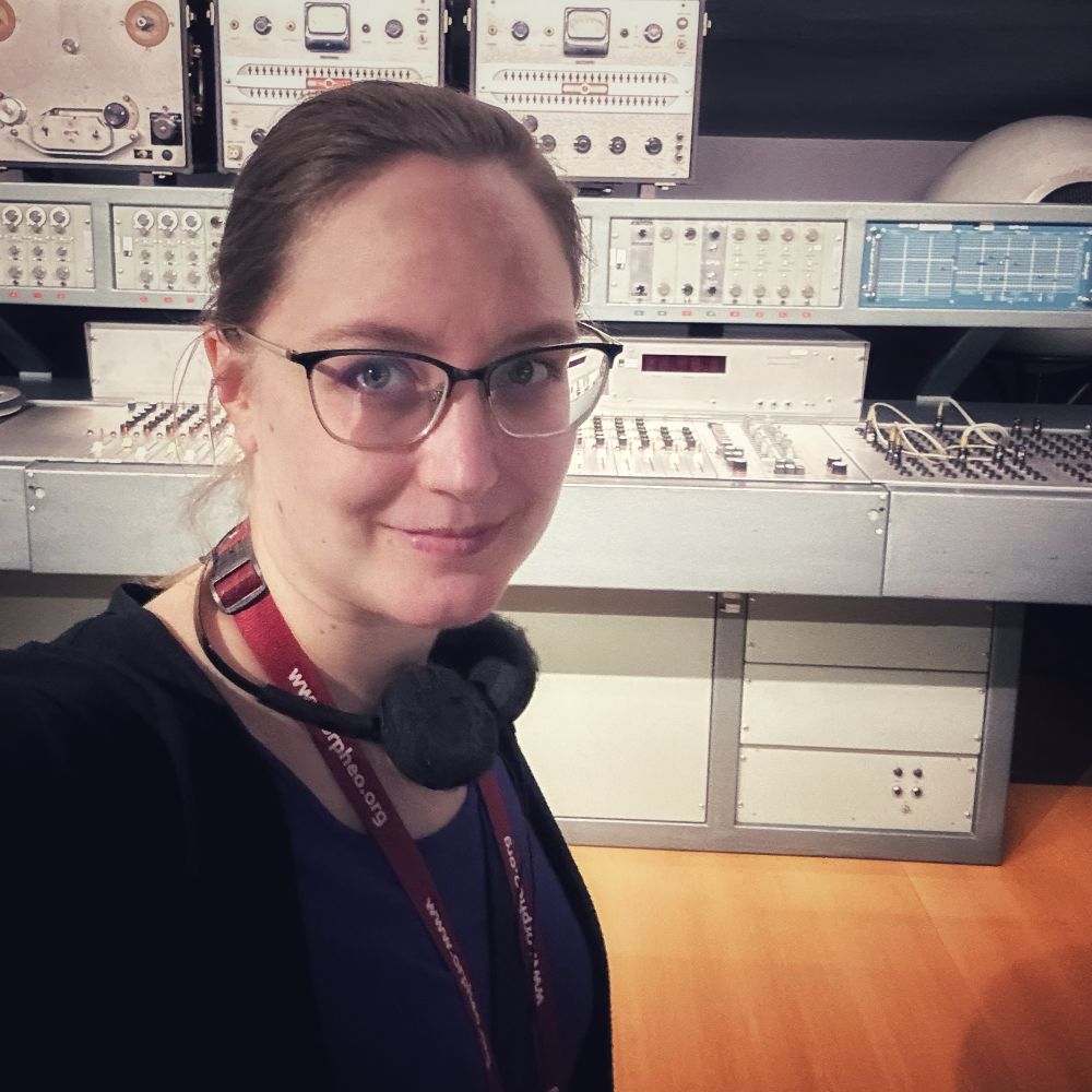 Me standing in front of a vintage mixing console from 1967 on display at Musée de la musique, Paris, France.