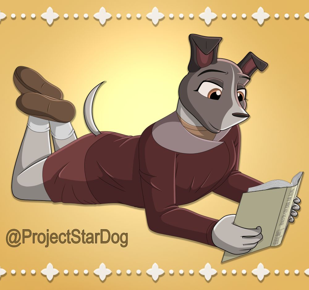 Laika laying on her stomach while reading a book