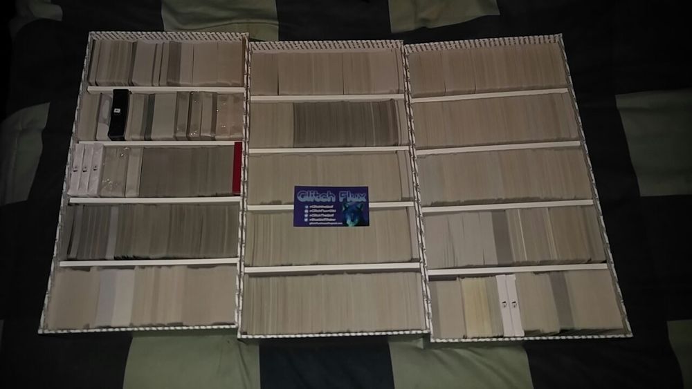 3 filled Bigger Blacker Box version 2.0's a business card with identification rests on top