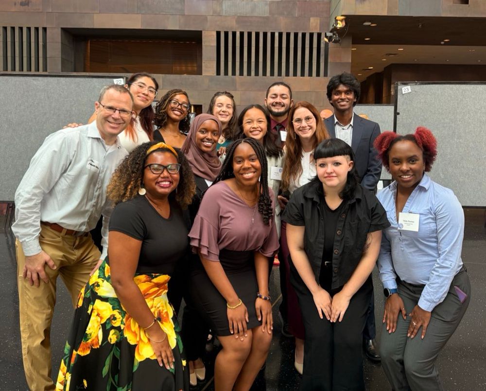 The 2025 neuroscience group of the Life Sciences Summer Undergraduate Research Program. The undergraduates and their program directors are all dressed up and smiling for a group photo at the end of the summer symposium