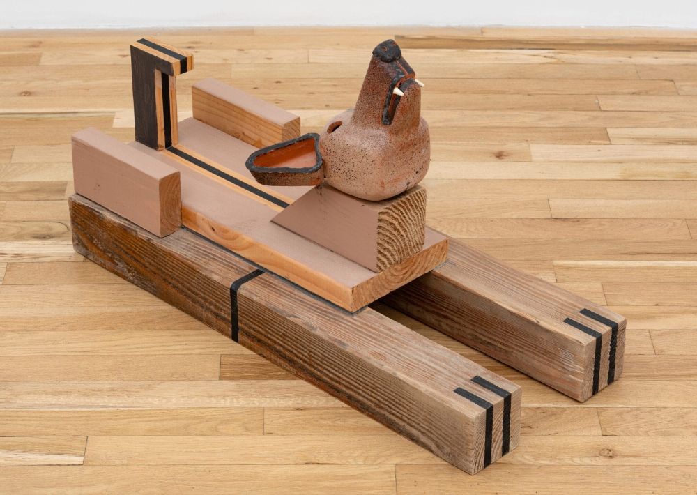 a floor sculpture by Steve Keister of a blocky wolf