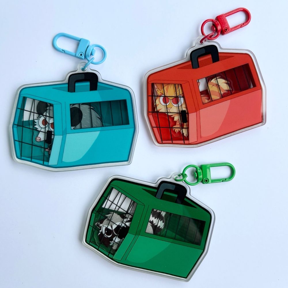 Shaker keychains of angry animals in kennels