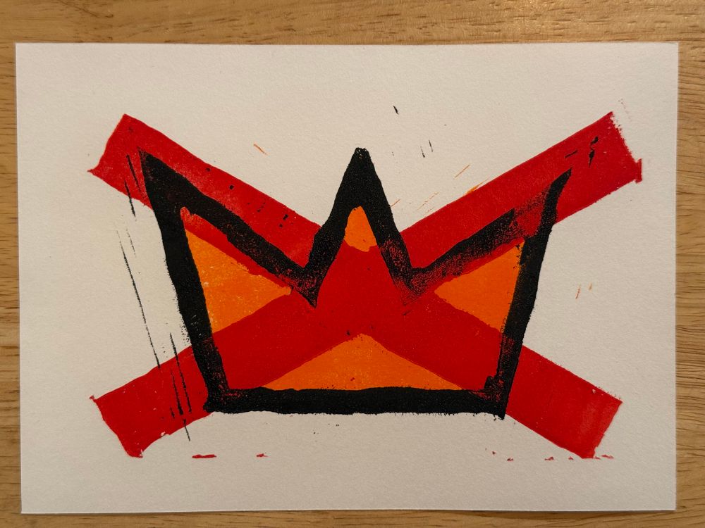 Lino print of the No Kings logo, showing a red X over an orange crown