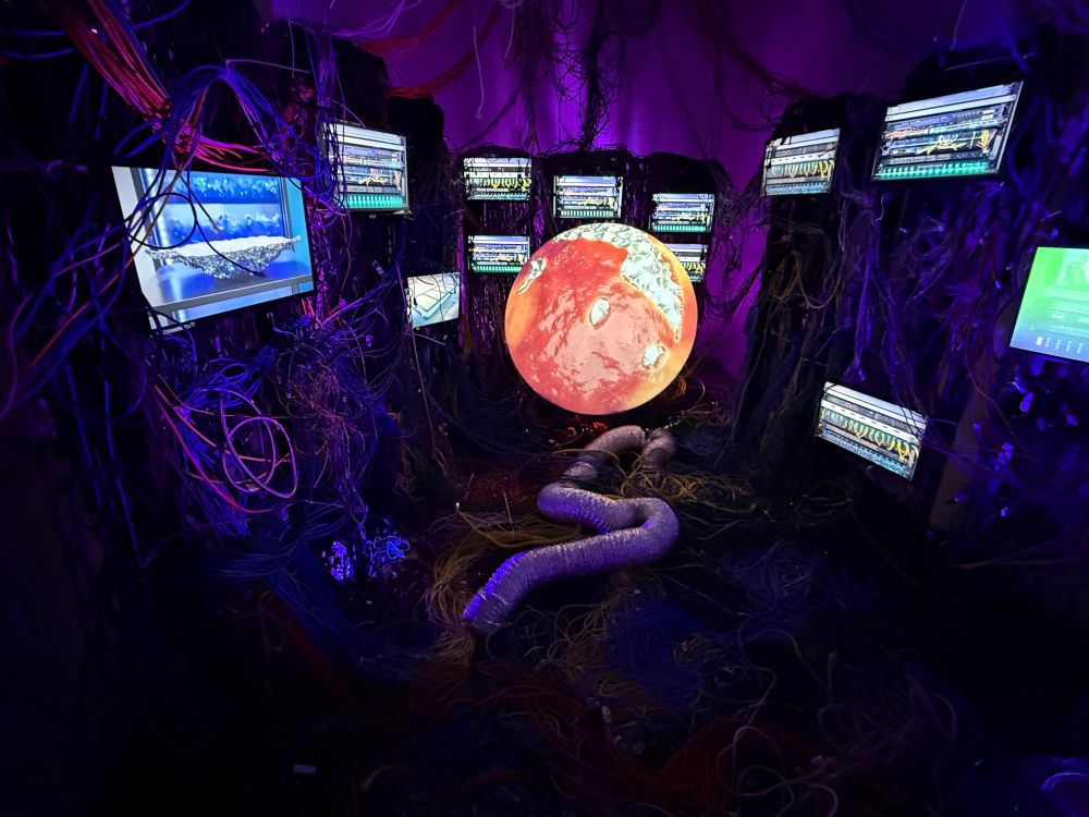 Art installation with computer screens and wires