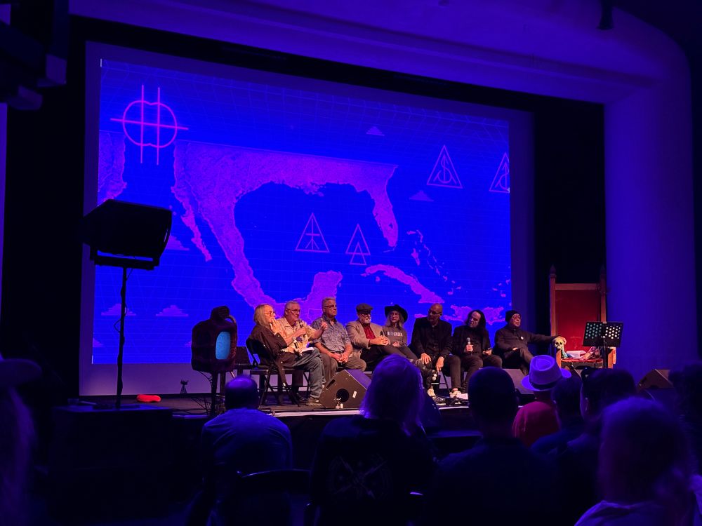 Panelists on stage at the Gulf of Deliria event